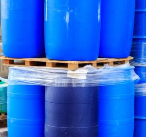 Blue plastic barrels on paletts in a chemical plant