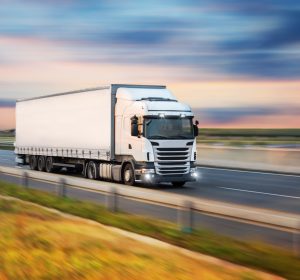 Truck with container on road, cargo transportation concept.